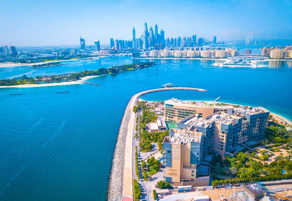 Experience the vibrant Dubai skyline with a breathtaking waterfront aerial view, showcasing modern architecture and urban beauty.